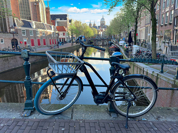 istock bike on canal ring, Amsterdam 2207049848