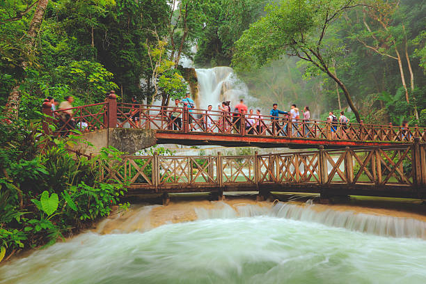 Luang Prabang, Laos - August 17. 2023 :  Kuang Si Waterfalls in Luang Prabang Laos. Long exposure. Beautiful waterfall in wild jungle