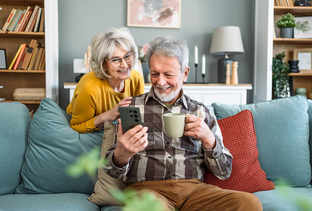 istock Happy senior couple using a smartphone 2207054044