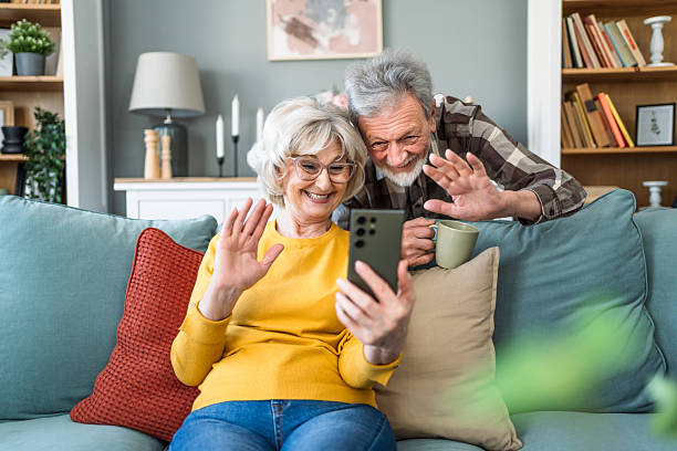 istock Senior couple having a video call at home 2207054103