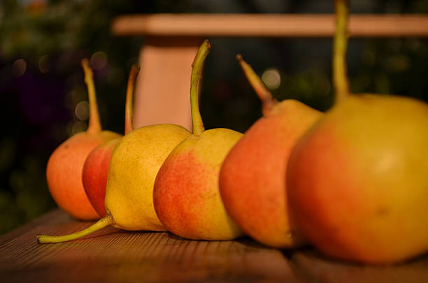 fresh pears on wooden background.