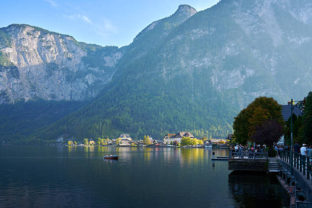 Tourists on the Seestrasse Waterfront street of the beautiful village of Hallstatt, Austria. September 28, 2023.