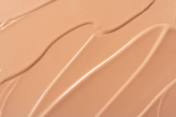 istock Close-up of smooth beige foundation or BB cream texture 2207057902