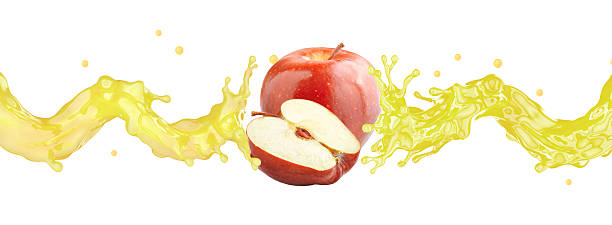 istock Apple juice splash with fresh ripe apple and apple half. 2207060321