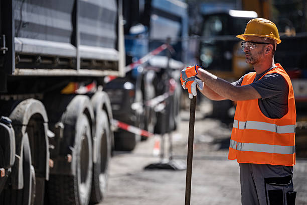 istock Construction Worker in Yellow Hard Hat and Vest 2207061718