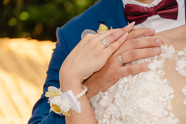 istock Bride and Groom holding hands 2207062171