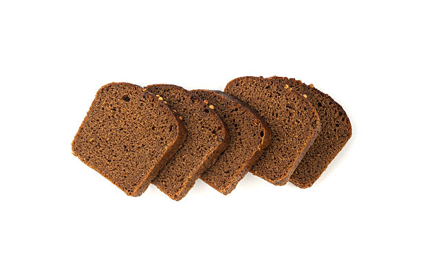 istock Black rye bread isolated, dark brown sliced loaf, sourdough borodinsky rugbrod square slices 2207062836