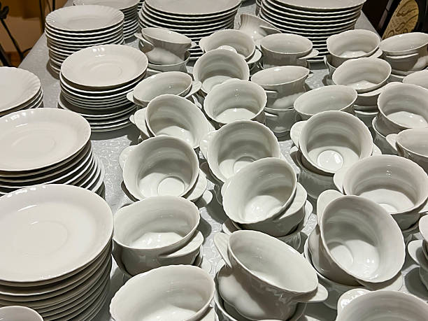 istock Cups, saucers and plates ready to be placed on tables 2207064141