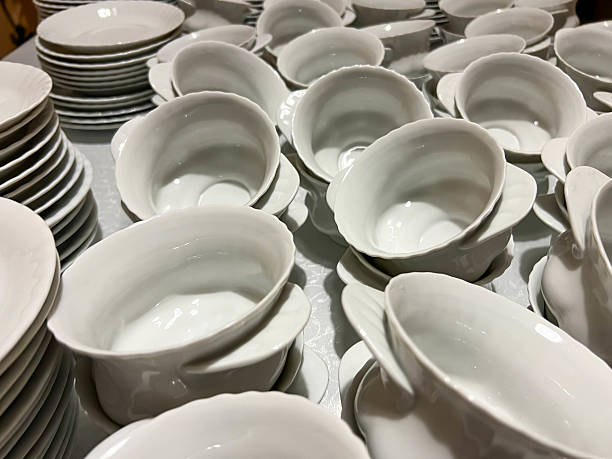 istock Cups, saucers and plates ready to be placed on tables 2207064165