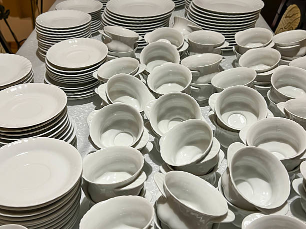 istock Cups, saucers and plates ready to be placed on tables 2207064414