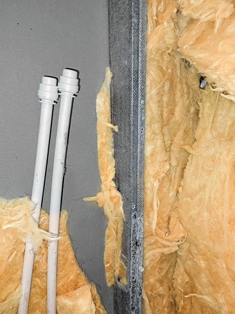 istock Interior Drywall Installation with Plastic PEX Water Pipes, Metal Stud Framing and Pink Fiberglass Insulation 2207065763
