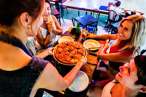 istock Customers talking to waitress in a restaurant 2207069784