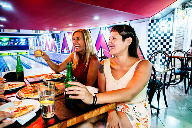 istock Female friends talking and drinking in a restaurant 2207069815