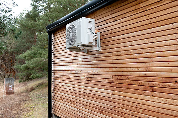 istock A log cabin with an air conditioner unit on the side 2207075990