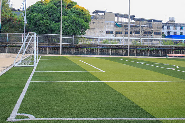istock Soccer field with a goal and a bench 2207081697
