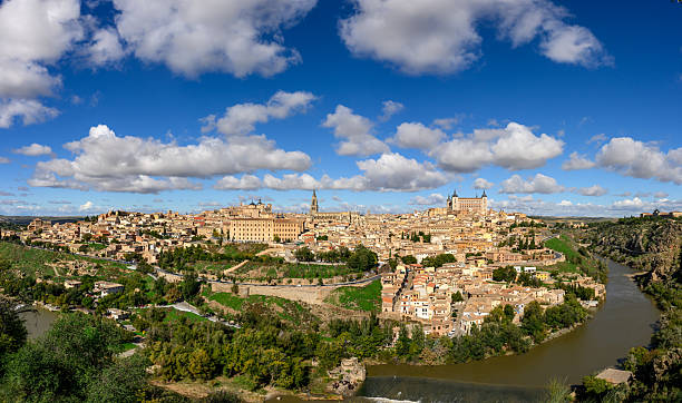 City skyline of Toledo under cloudy blue sky