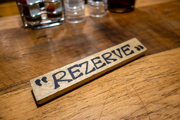 Close-up on a reserved sign on a table at a restaurant.