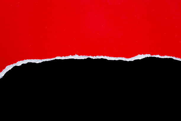 istock Red ripped paper torn edges strips isolated on black background 2207090372