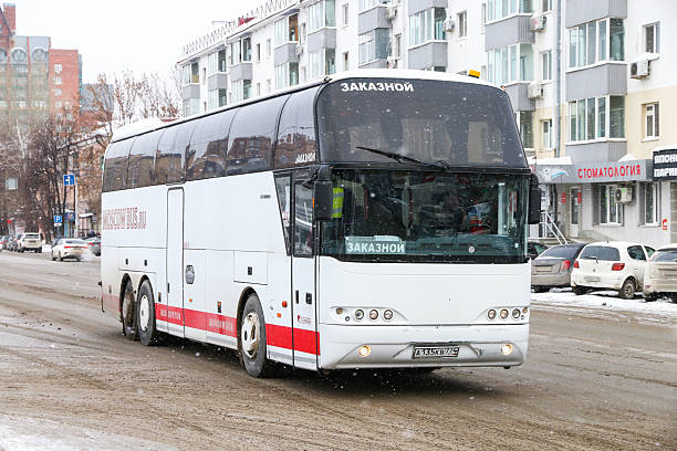 Ufa, Russia - February 11, 2023: Touristic coach bus Neoplan N1116/3H Cityliner in the city street.