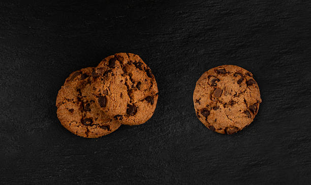istock Chocolate chips pile cookies , American biscuits, cocoa confectionery cake, sweet morsels bakery 2207096183