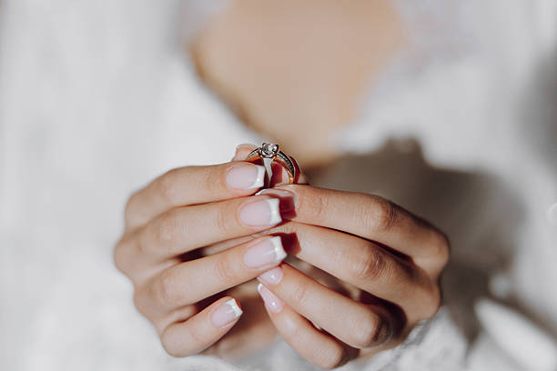 istock A woman is holding a ring in her hand 2207097949