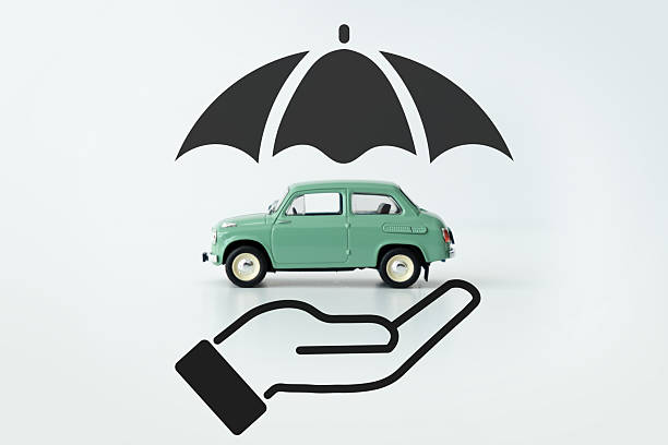 istock Car protected by umbrella, insurance concept 2207098739