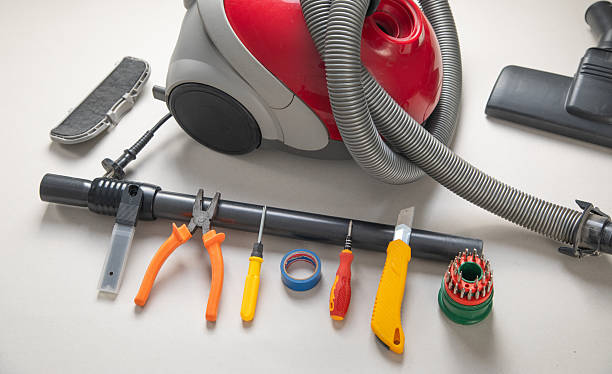 istock Broken vacuum cleaner and tools. Vacuum cleaner repairing 2207099269