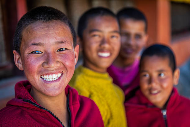 istock Novice Tibetan monks posing in Tsarang monastery, Upper Mustang, Nepal 2207100417