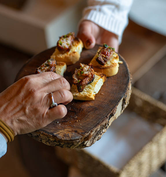 Serving sweetbread tapas Argentine style on a wooden board