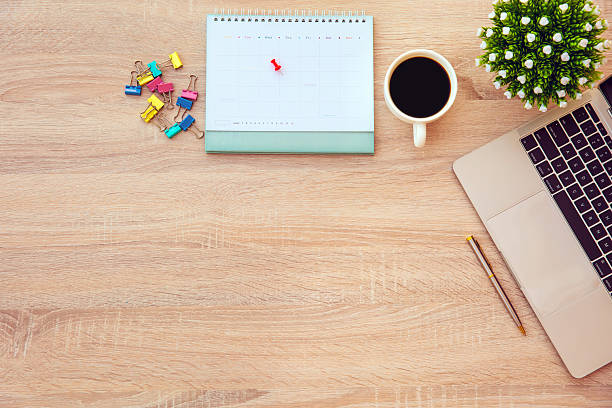istock Top view desk or top view table or wooden office desk flat lay background with computer laptop and office equipment for work area copy space and education school concepts. 2207105435