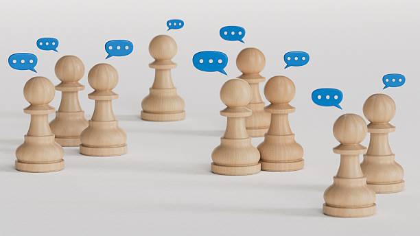 istock Team discussion, Community or social feedback. Communication or announcement dialog. Business meeting. Teamwork and communication concept. Many wooden figure with speech bubble. 2207108139