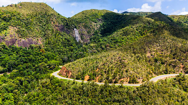 istock Mountain road with a waterfall in the background. 2207109704