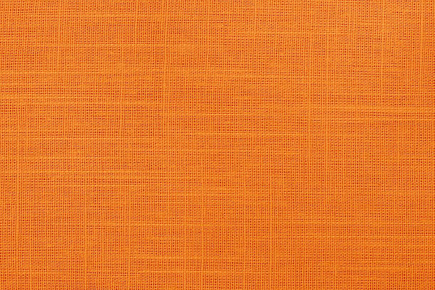 istock Orange linen fabric cloth texture for background, natural textile pattern. 2207110917