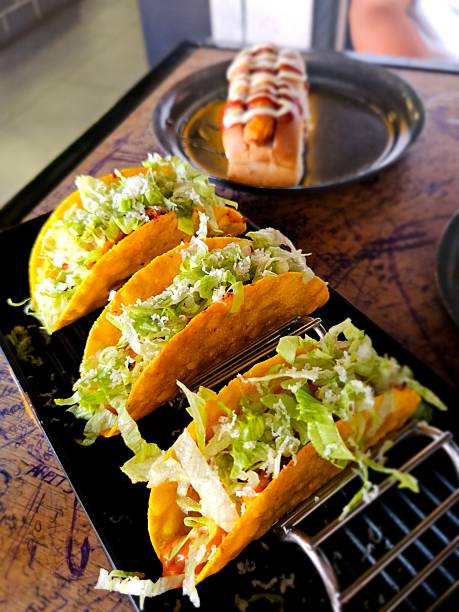 Delicious Crispy Tacos with Fresh Lettuce and Cheese