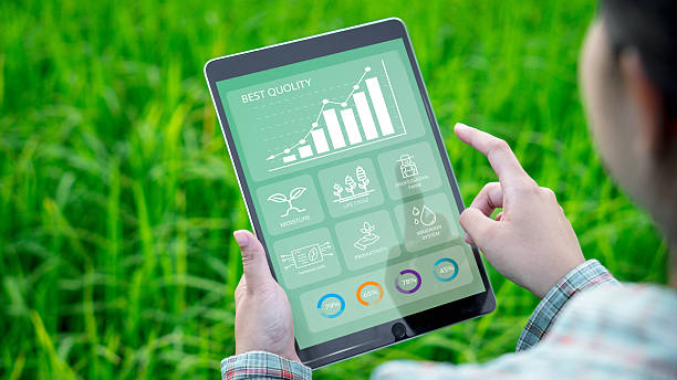 istock Farmers use agricultural technology in data analysis tablets and image icons. New technologies in agricultural business concepts. Men use tablets to research and develop plant varieties, agricultural 2207118953