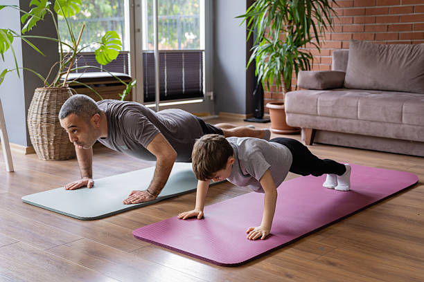 istock Father And Little Son Doing Home Exercises 2207122708