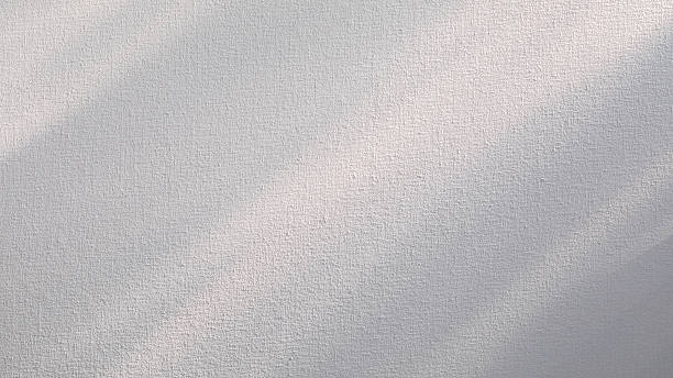 istock Sunlight beams on white primed artist canvas. Texture background 2207122802