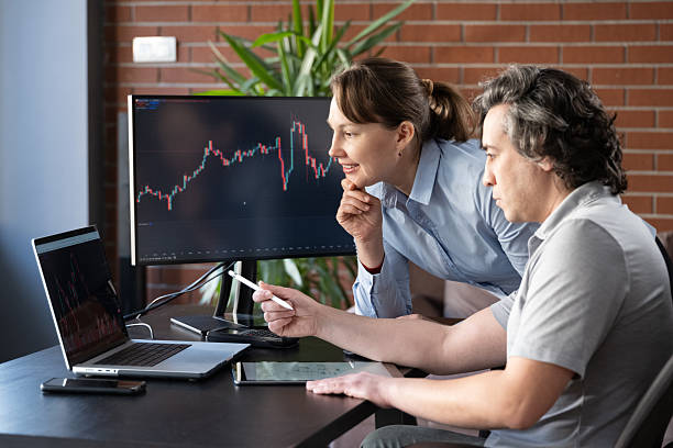 istock Businesspeople working in the office on stock market exchange data using TradingView 2207124735