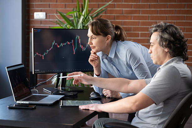 istock Businesspeople working in the office on stock market exchange data using TradingView 2207124931