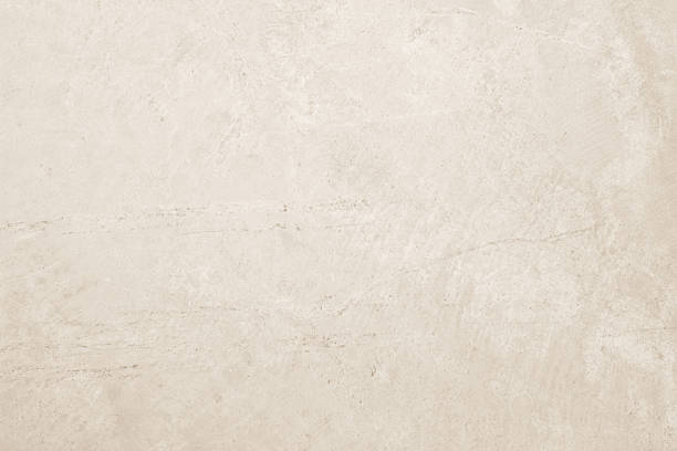 istock Colour old concrete wall texture background. Close up retro plain cream color cement wall background texture. Design paper vintage parchment element. 2207128431
