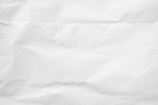 istock White recycled craft paper texture as background. Grey paper texture, Old vintage page or grunge vignette of old newspaper. Pattern rough art creased grunge letter. Hardboard with copy space for text. 2207128440