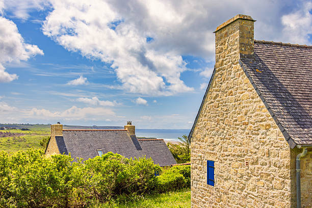 istock Old stone cottage on the coast with a sea view 2207129578