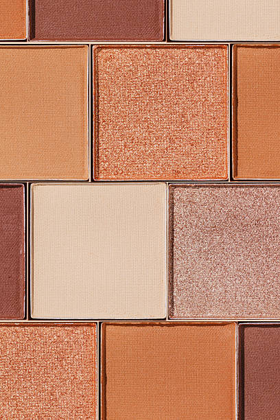 istock Cosmetics texture pattern, makeup palette vivid neutral color eye shadow, square eye powder swatches. Female cosmetic and beauty products, aesthetic minimal beauty photo, colorful eyeshade, top view 2207129669