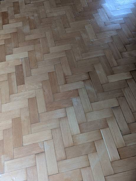 istock Polished oak parquet flooring in a herring bone pattern 2207133056