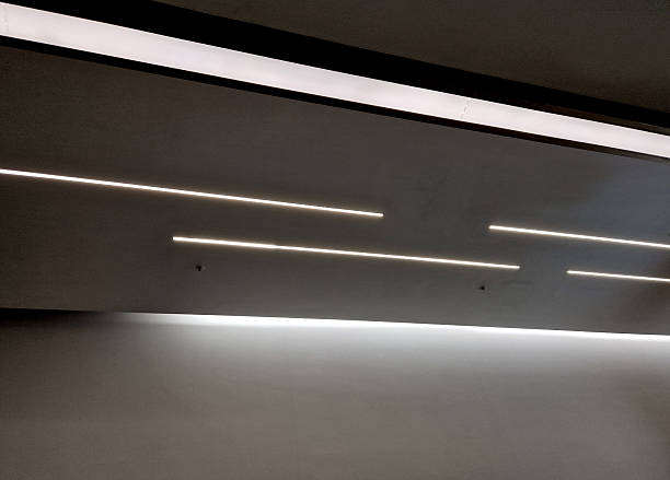 istock Strips of lights in the ceiling soffit. LED lights in a one-way dynamic look. Drywall construction work 2207133849