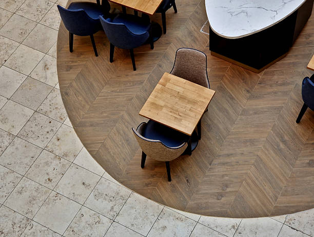 istock low short seats with padding and armrests facing each other and a natural wood table standing between them. hinged doors allow the waiter to open with his foot or side of his body while carrying drink 2207135470