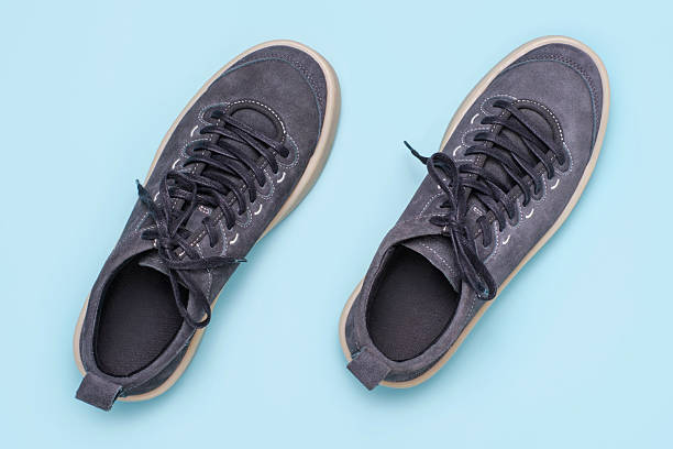 istock Gray sneakers on blue background close-up, top view. 2207137869