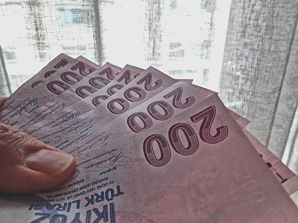 istock Hands holding lots of TL 2207138241
