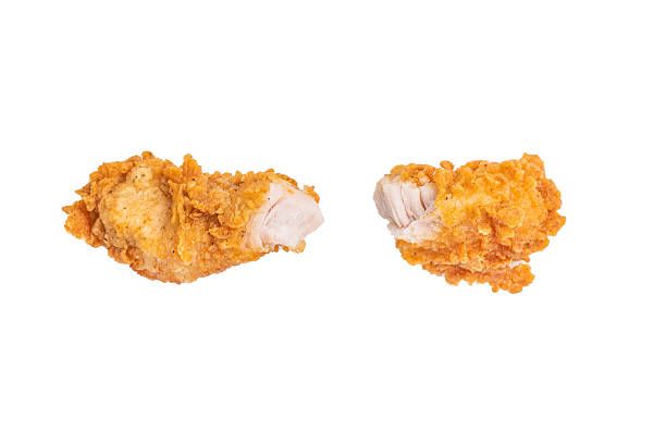 Crispy fried chicken strips from breast fillet isolated on white background.