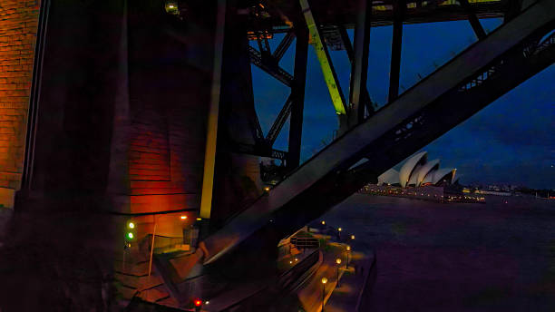 istock Underneath Sydney Harbour Bridge at night with illuminated steel structure 2207140195